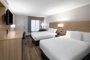 Newly renovated hotel room with two beds and modern design at Baymont Nashville Airport