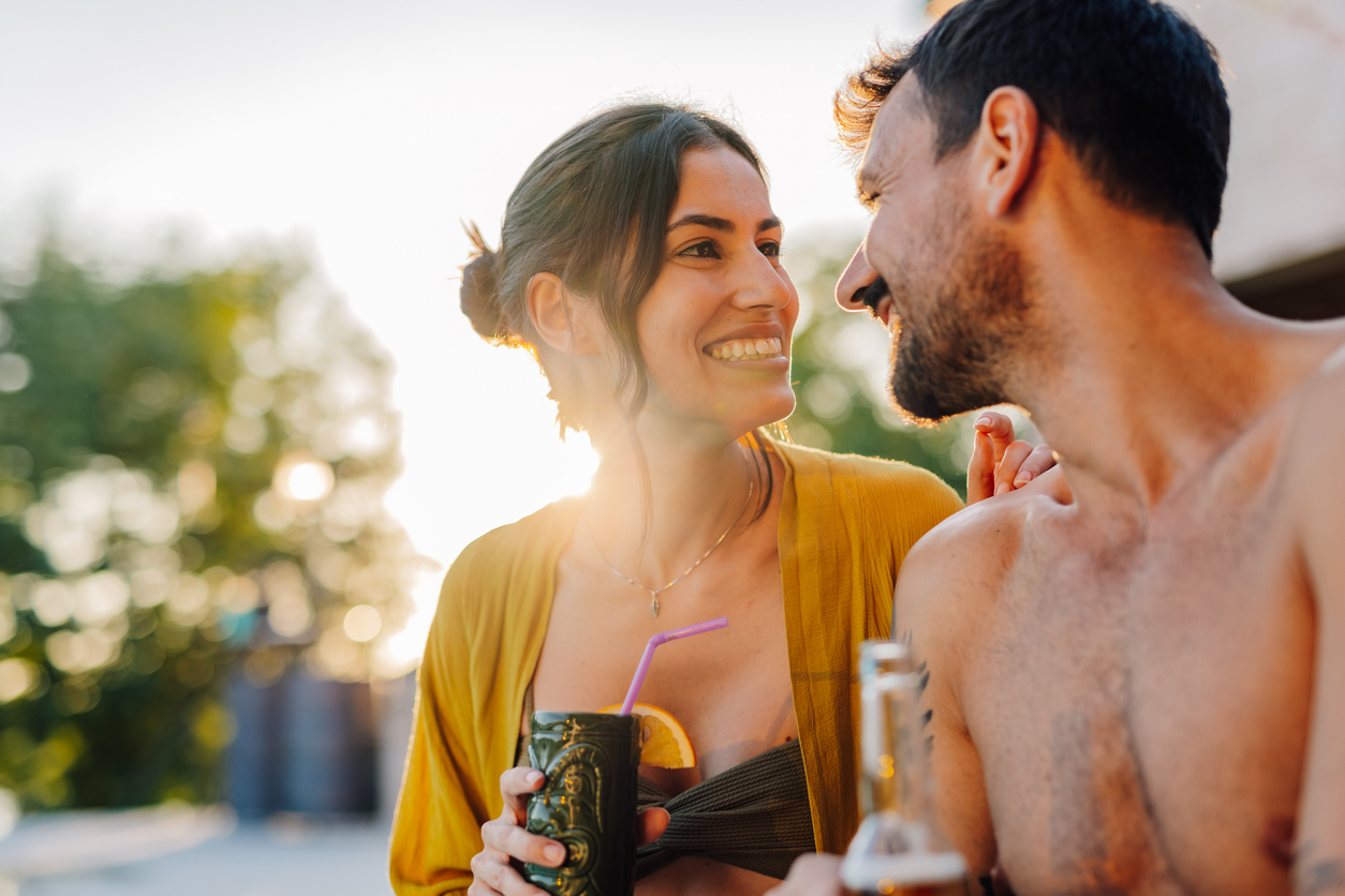 Couple relaxing at outdoor pool during golden hour near Nashville Airport