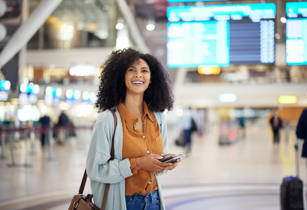 Traveler smiling inside airport terminal during a Nashville trip