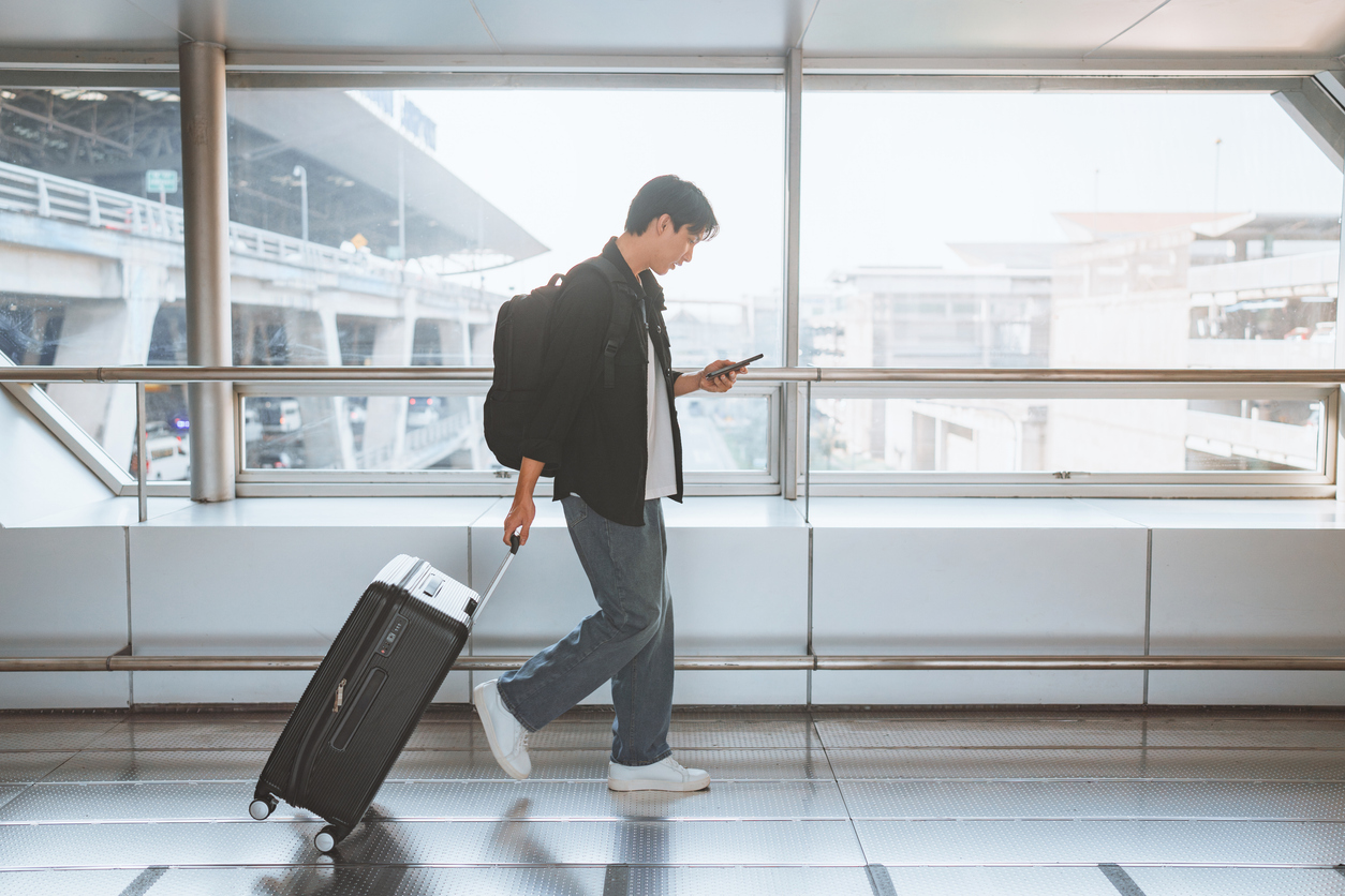 Traveler with luggage at the airport