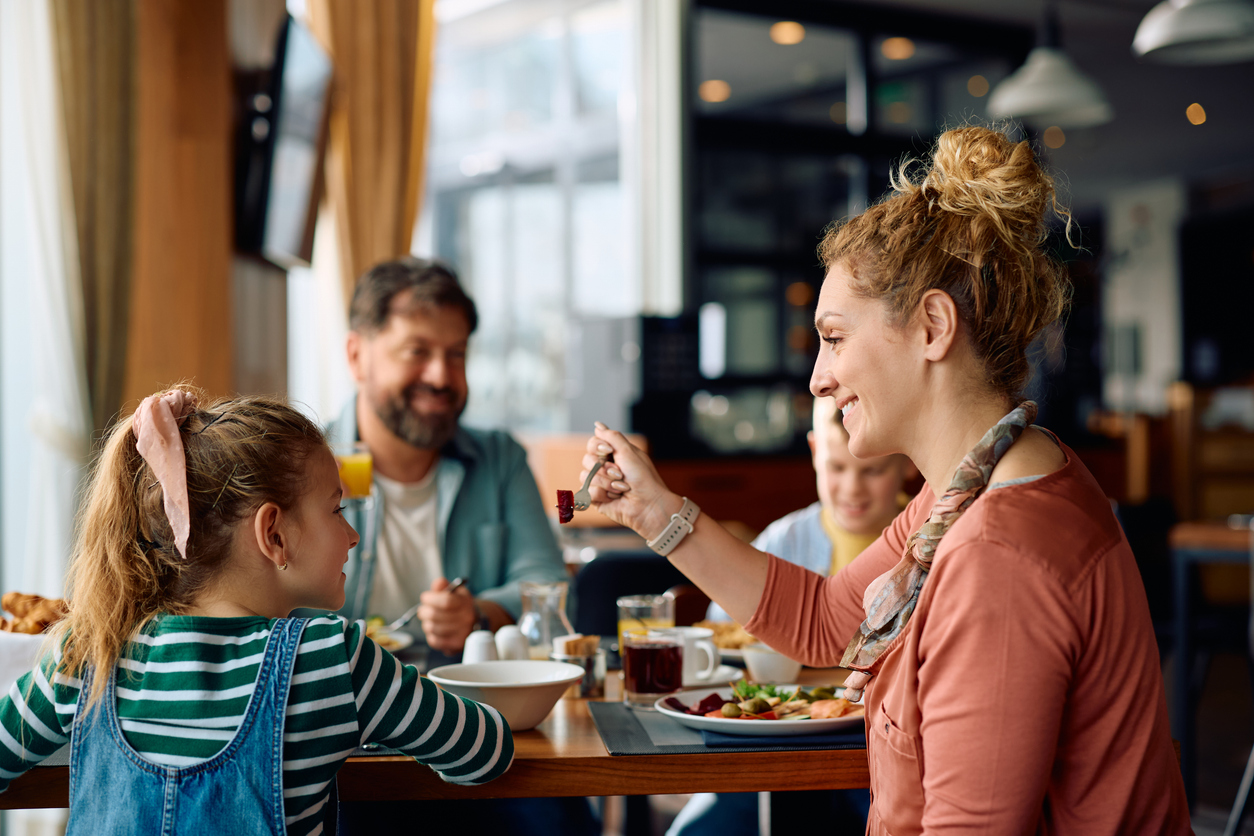 Family enjoying breakfast together at a restaurant