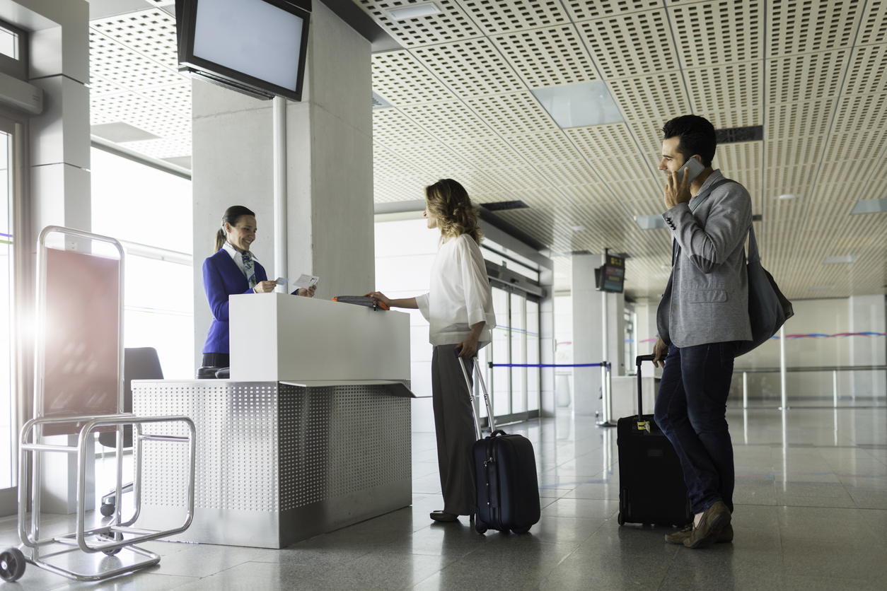 Travelers preparing to board a flight at an airport